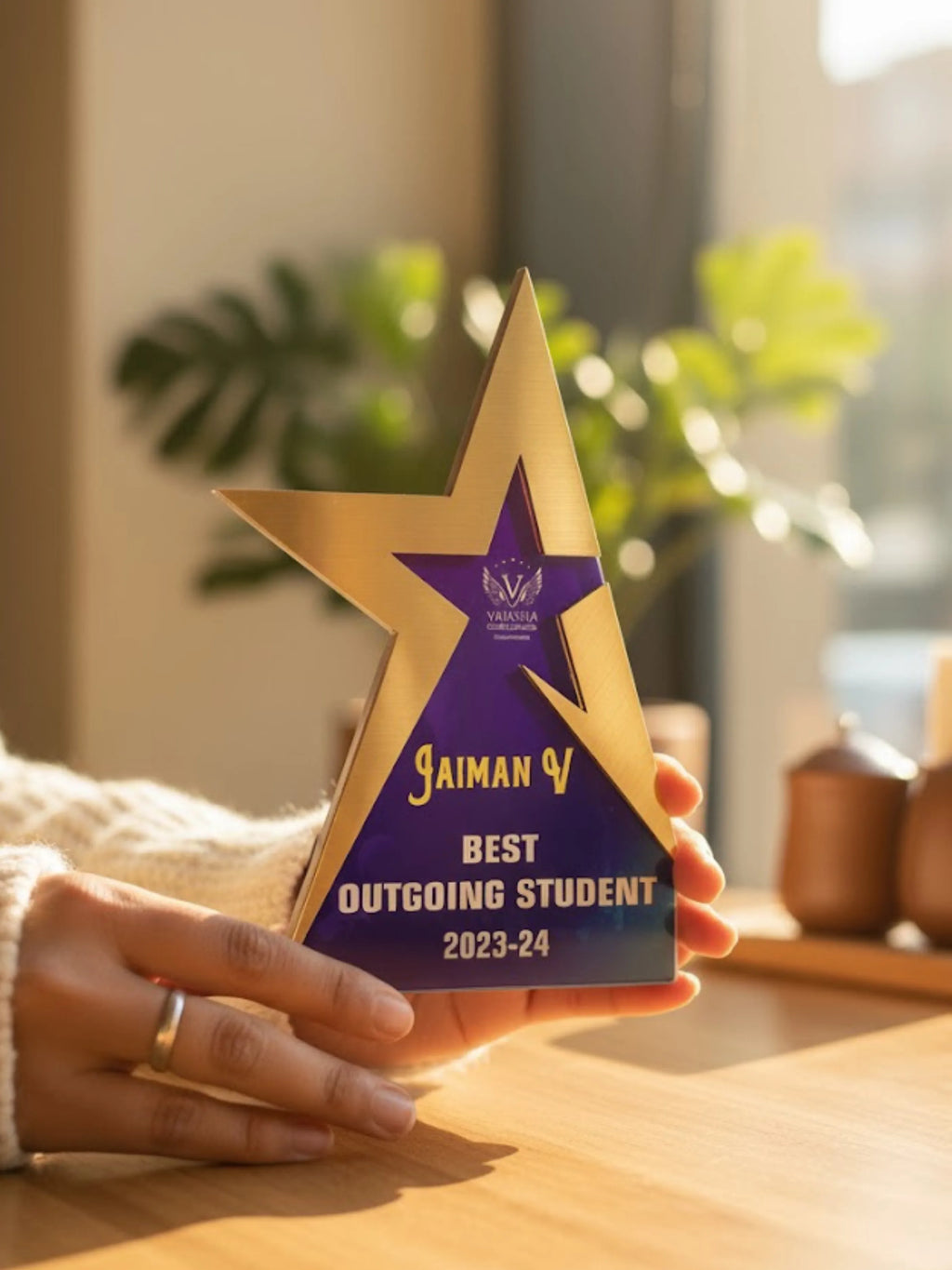 Three trophies of varying heights (small, medium, and large), each designed for different recognition levels and occasions.