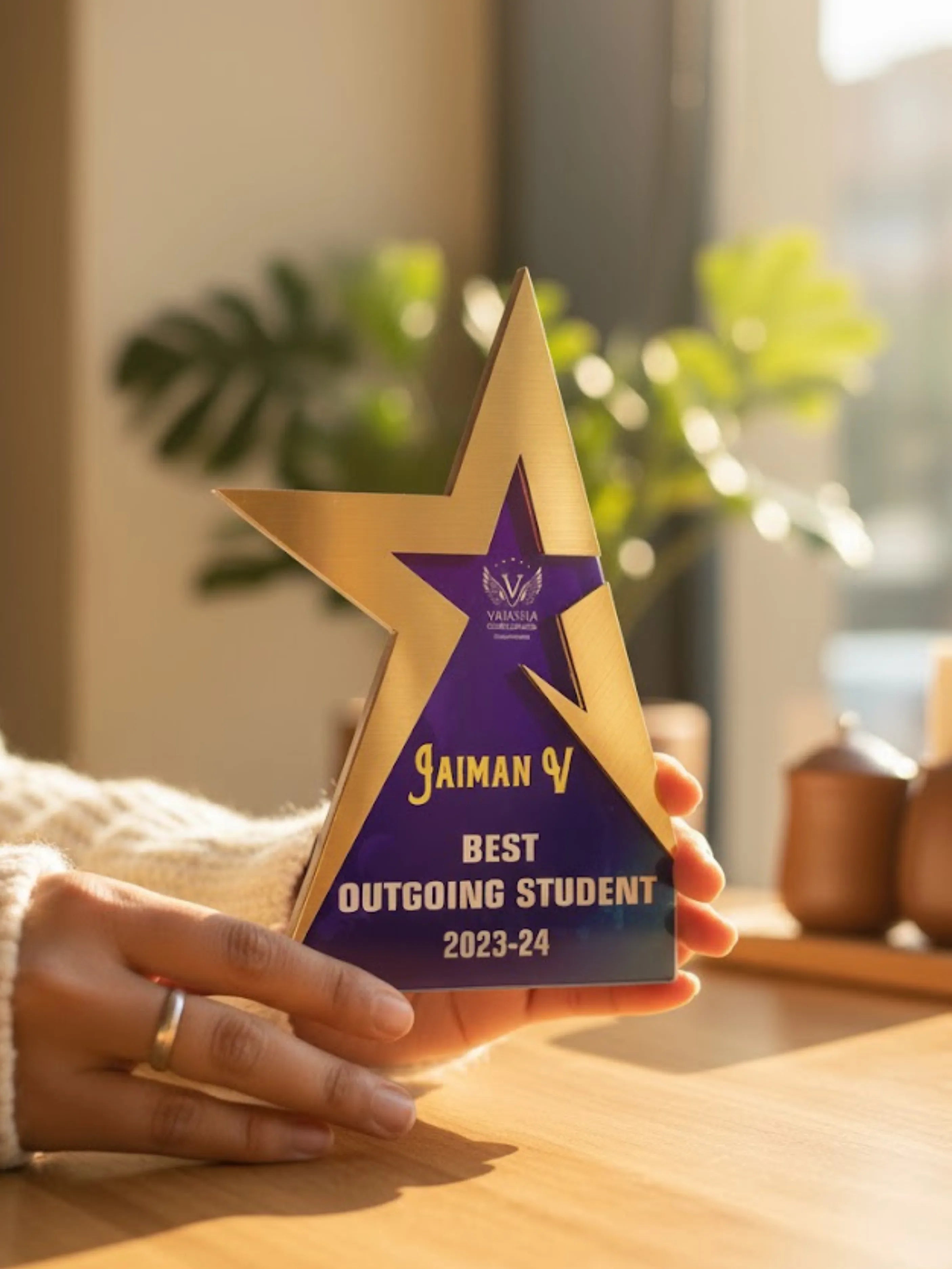 Three trophies of varying heights (small, medium, and large), each designed for different recognition levels and occasions.