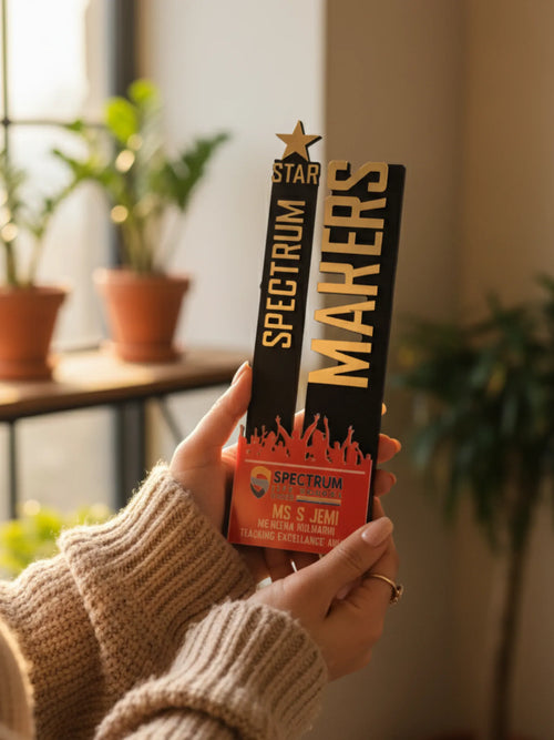 Person holding a Spectrum Makers product with plants in the background