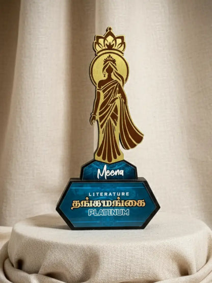 Decorative trophy with a figure and 'Meena' branding on a beige background