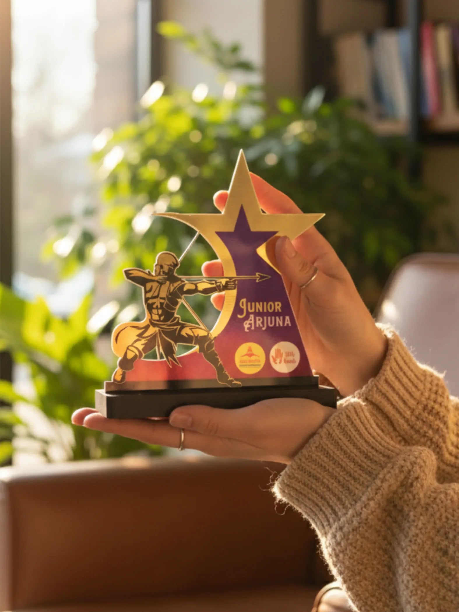 Archery trophy size comparison showing different award options