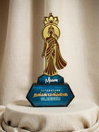 Decorative award with a figure and 'Meena' branding on a beige background