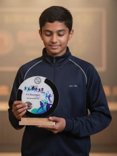 Person holding an award with a blurred background