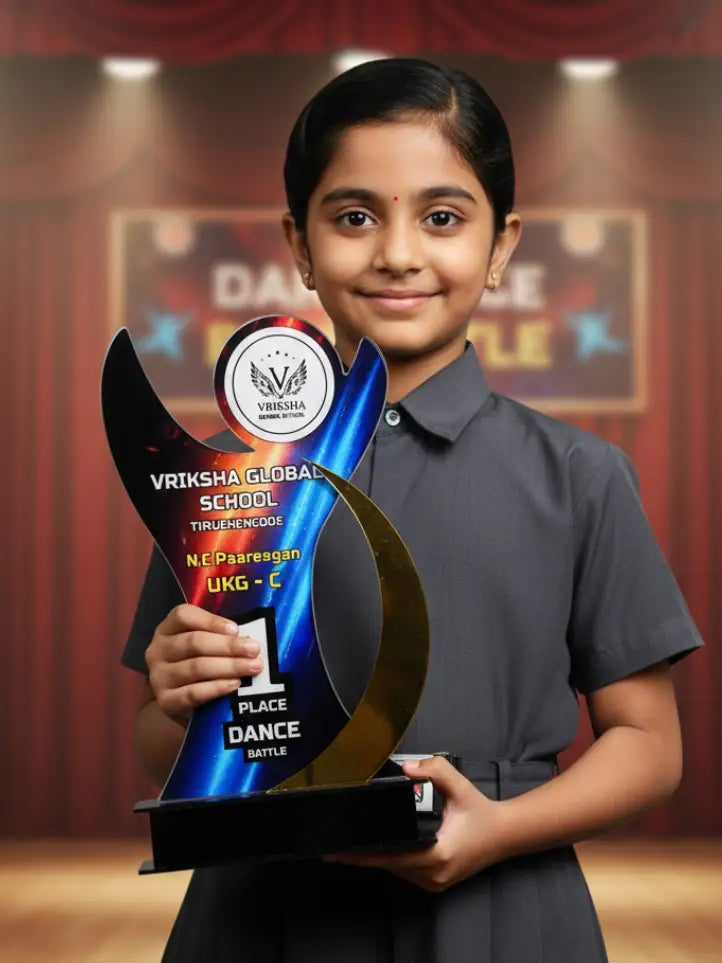 Young girl holding a trophy with 'Vriksha Global School' on a stage.