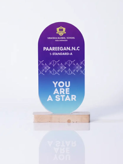 Decorative plaque with text on a stand against a white background