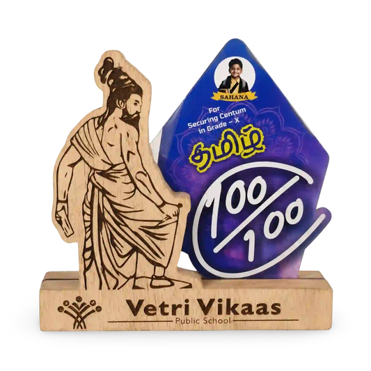Wooden statue and purple award with 'Vetri Vikaas' branding on a white background