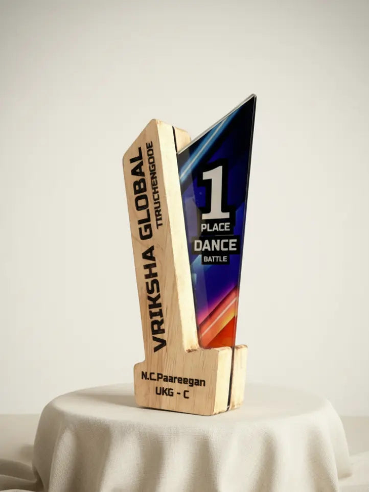 Trophy with 'Vriksha Global Trichy' branding and '1 Place Dance Battle' text on a light background