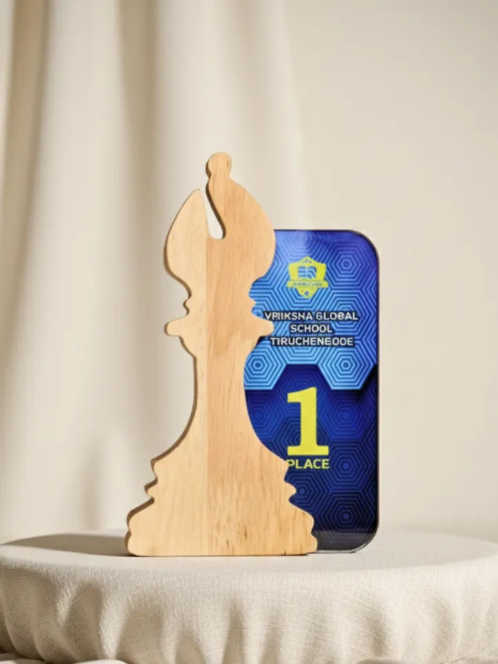 Wooden chess piece with a smartphone displaying a school logo and '1st Place' text on a beige background