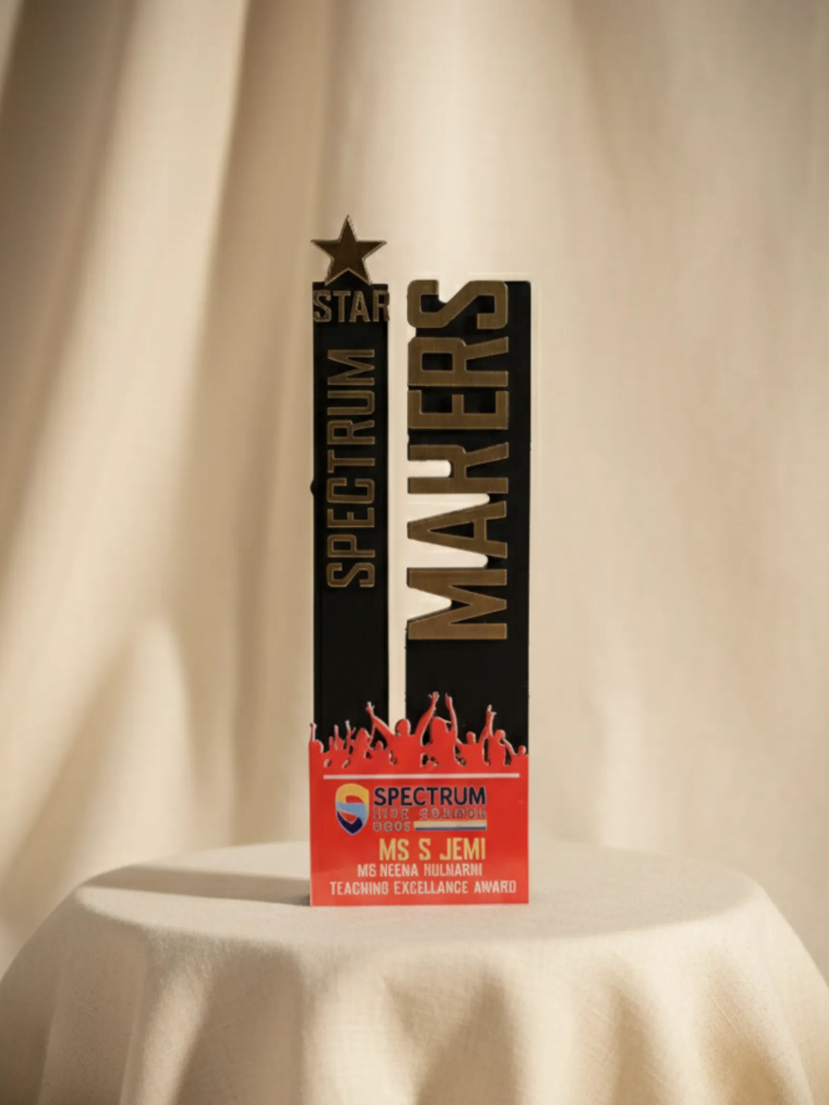 Spectrum Makers award on a beige background