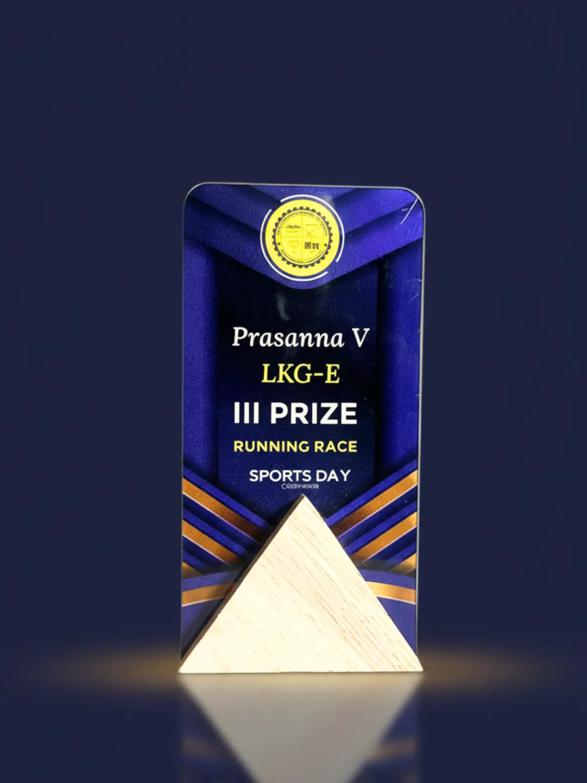 Decorative award with 'Prasanna V LKG-E III Prize Running Race Sports Day' text on a dark background