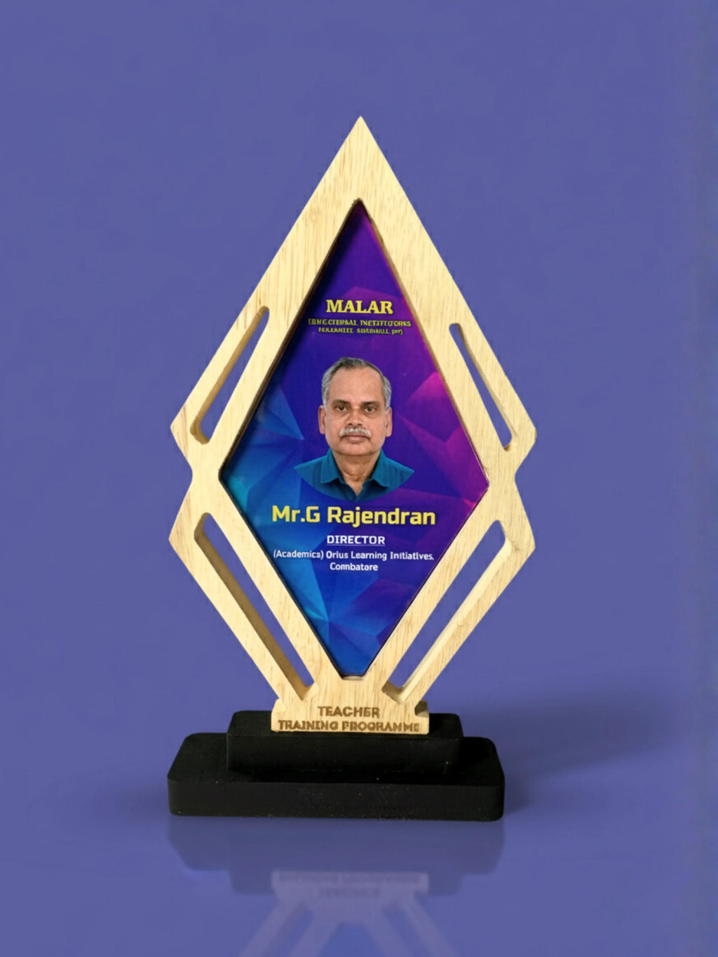 Awards trophy with a portrait of a person on a blue background