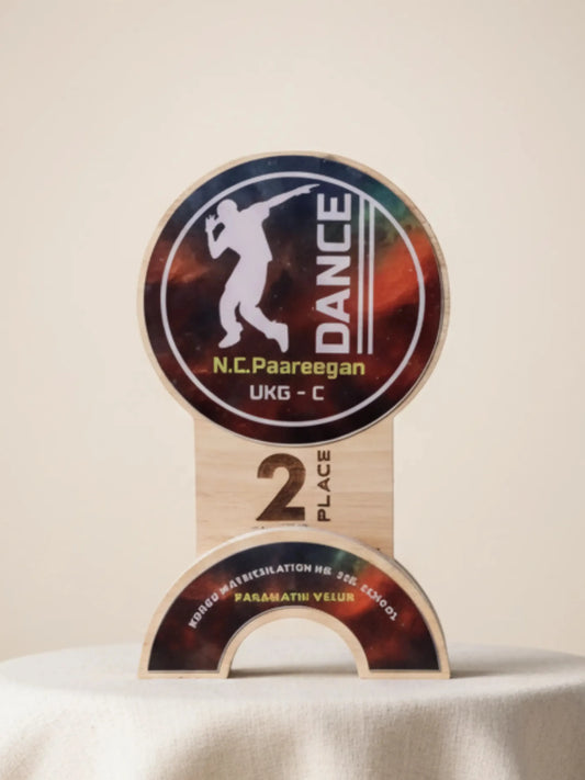 Trophy with 'DANCE' and 'N.C. Paareegan' text on a beige background