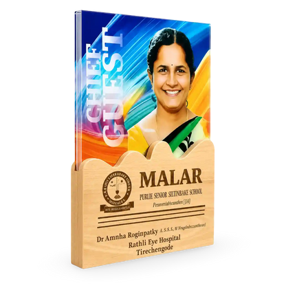Book titled 'Chief Guest' with a portrait of a woman on the cover, placed in a wooden holder.