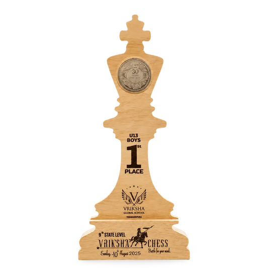 Wooden chess piece trophy with engraved text on a white background