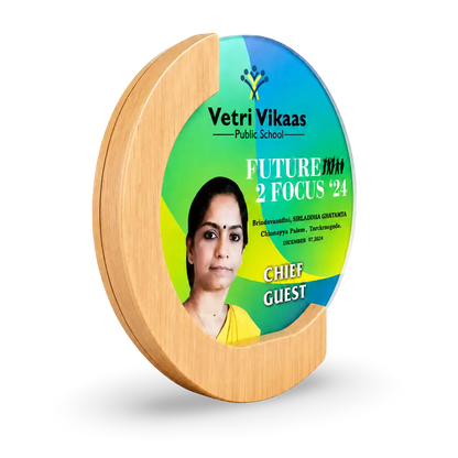 Round wooden plaque with a photo of a woman and 'Vetri Vikaas Public School' branding on a white background