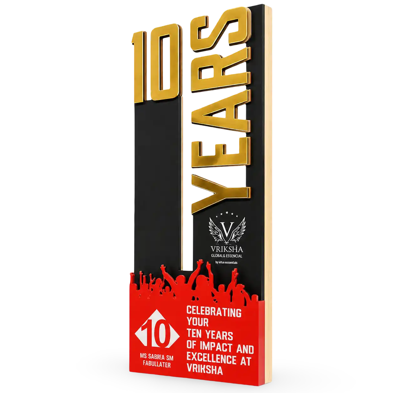 Vriksha 10th anniversary celebration plaque with gold text and red design elements.