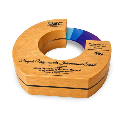 Wooden award with engraved text on a white background
