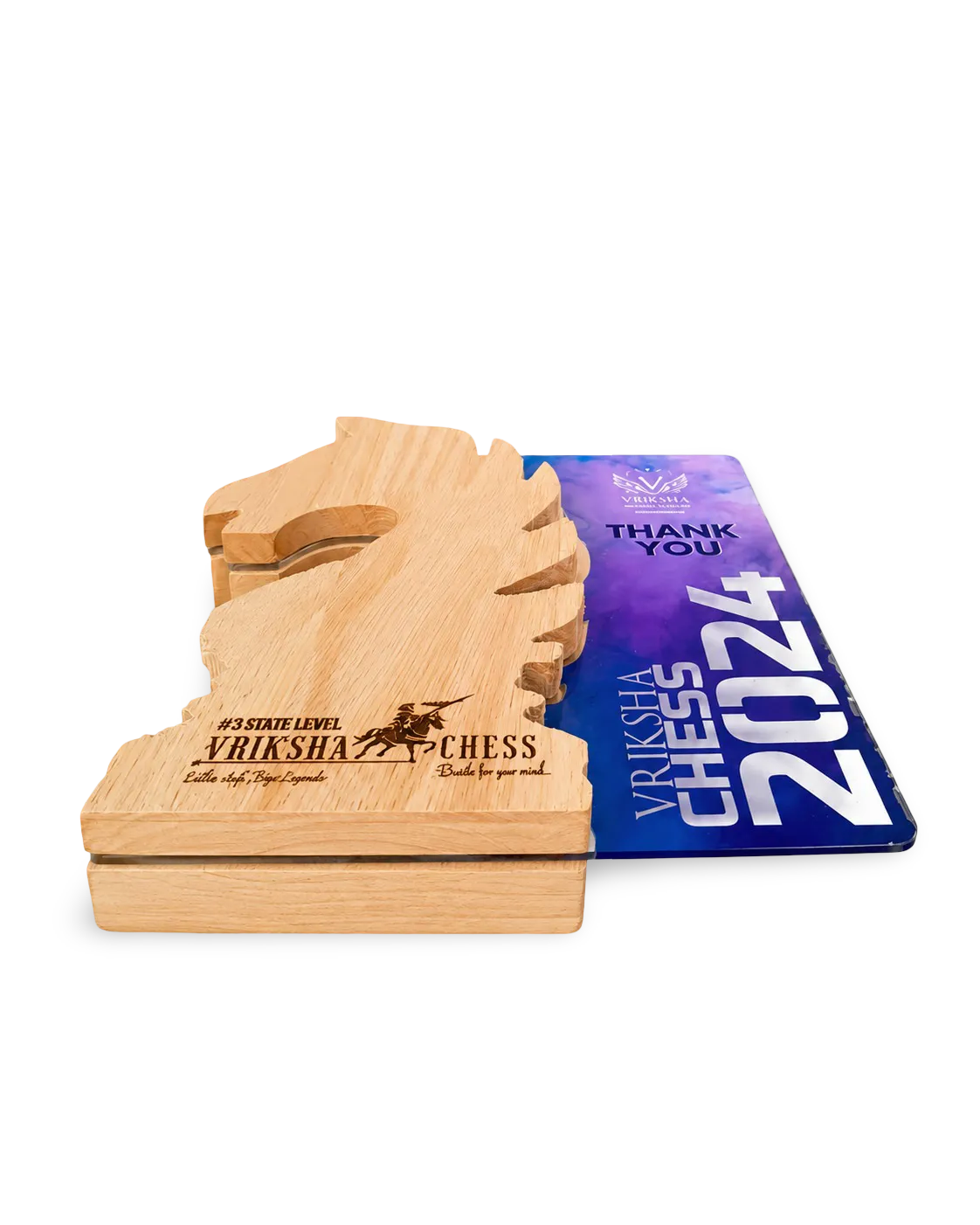 Wooden chess piece with engraved text on a white background