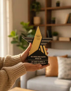 Person holding a star-shaped award in a living room setting