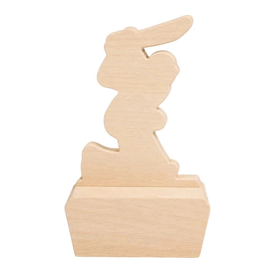 A light natural wood bunny-shaped decorative object mounted on a rectangular wooden base, shown against a plain white background.