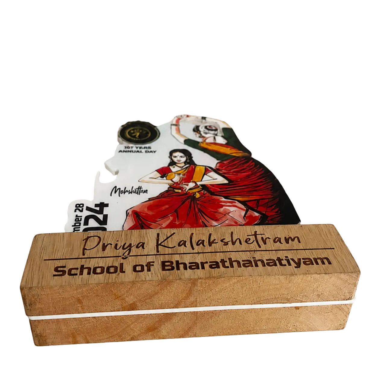 Wooden box with 'Priya Kalakshetram School of Bharathahatiyam' branding, featuring a dancer on top.