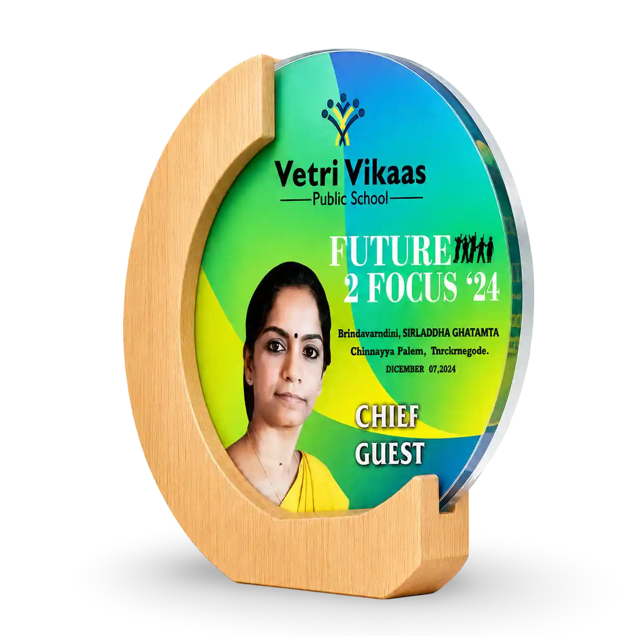 Decorative plate with a photo of a woman and text about Vetri Vikaas Public School's 'Future 2 Focus '24' event.