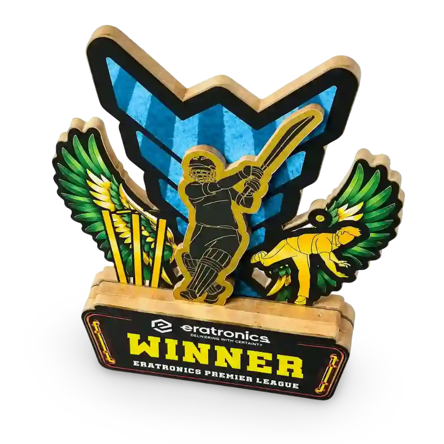 A wooden cricket-themed trophy plaque featuring a cricket player silhouette, green and gold wings, a blue shield, and a base reading 'eratronics WINNER ERATRONICS PREMIER LEAGUE'.