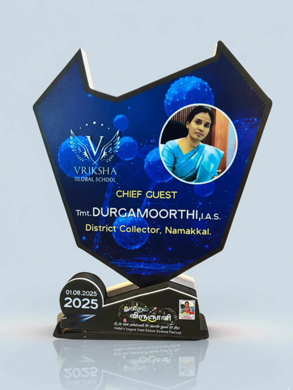 Decorative award with a portrait of a woman and text on a blue background