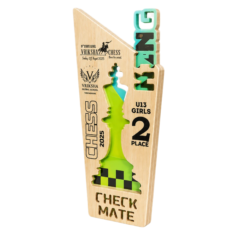 A wooden trophy plaque for the 2025 U13 Girls Chess Championship, featuring a light natural wood base with laser-engraved text and a colorful cutout of a chess piece in green, black, and white, with the word 'VIRKSHA' in 3D letters on the right side.