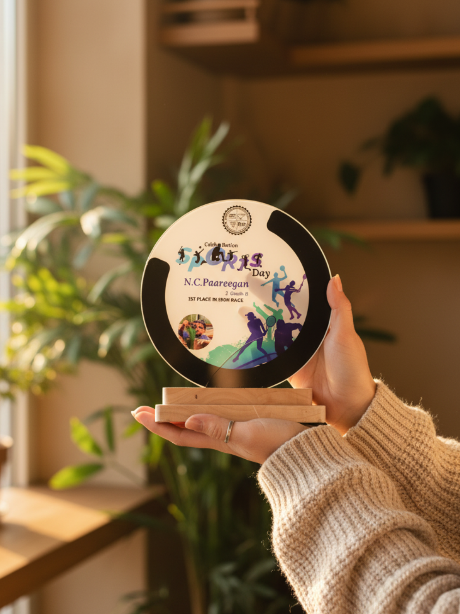 Sports day trophy displayed in running race award ceremony setting