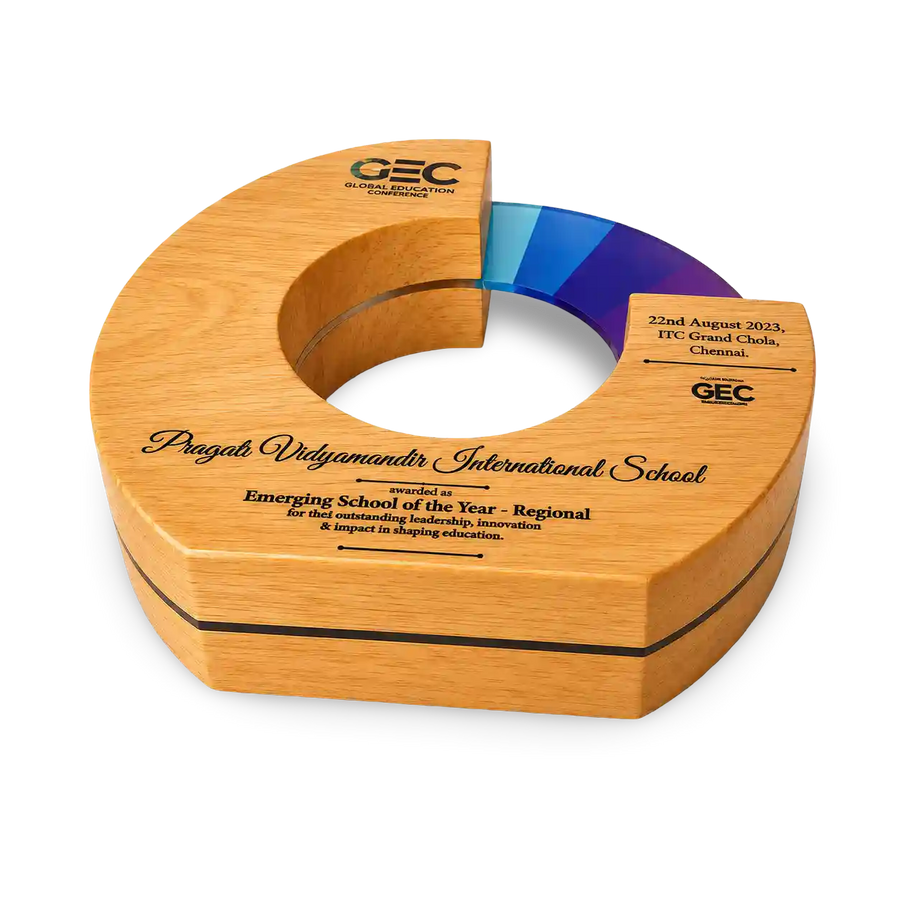 Wooden award with engraved text on a white background