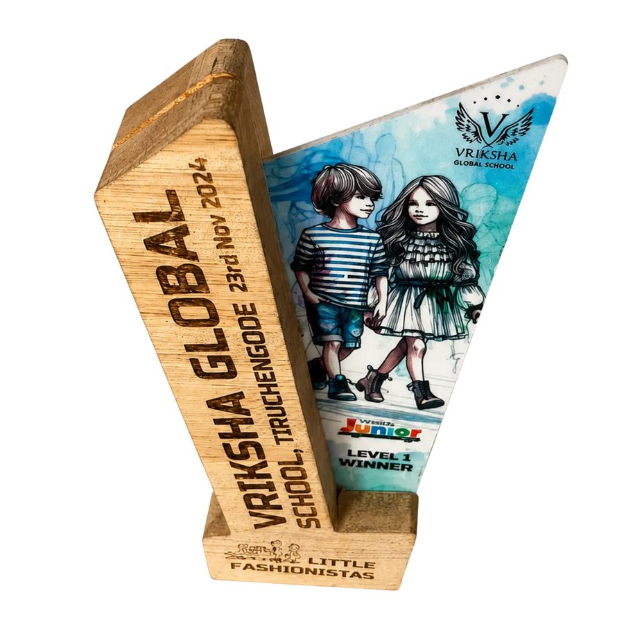 Wooden award with a design of two children and text on a white background