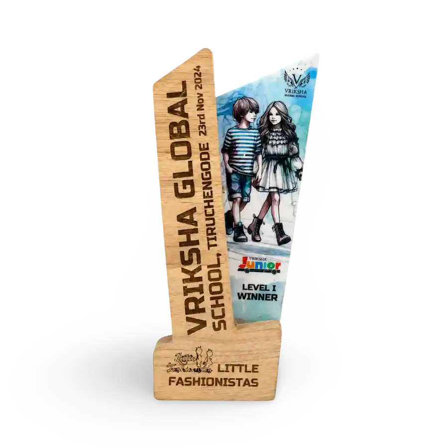Wooden award with engraved text and a cartoon illustration of two children on a white background