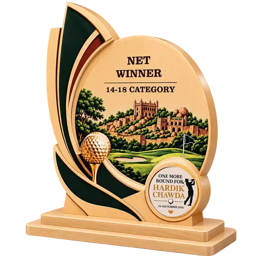 Angled view of golf award trophy showing golf ball, course scene and recipient plaque